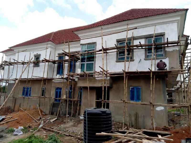 Two-storey home, render and glazing in progress