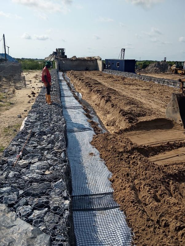 Geotextile and rock lining to a diversion channel