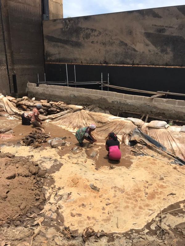 Geomembrane being laid against the existing structure