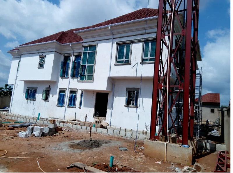 Hoist tower in place during external finishing