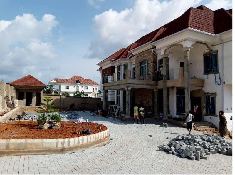 Completed duplex with paved forecourt and landscaping