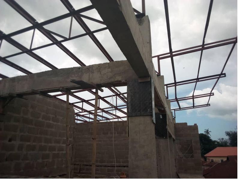 Blockwork walls and steel roof to the store